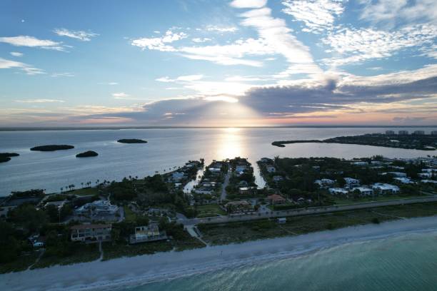 Aerial view of Longboat Key town against a scenic sunrise An aerial view of Longboat Key town against a scenic sunrise longboat key stock pictures, royalty-free photos & images