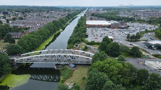 An aerial view of algal bloom on the Manchester Ship Canal with a swing bridge
