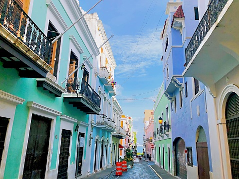 San Juan, Puerto Rico – May 05, 2018: Colorful buildings and ocean-toward street view in Puerto Rico on a sunny day
