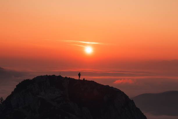 istock Beautiful cloudy sunrise over the mountains 1446638075
