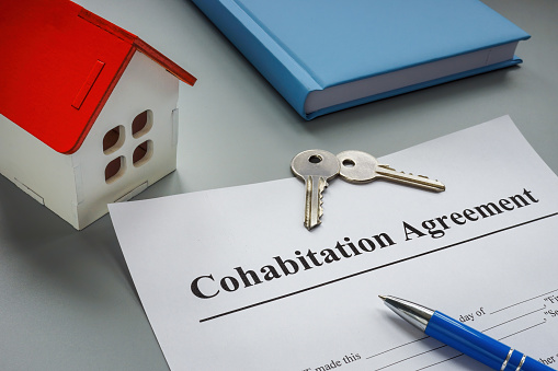 A Cohabitation agreement, keys and model of home.