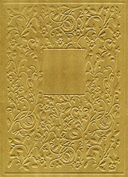 Gold colored paper with floral pattern background.