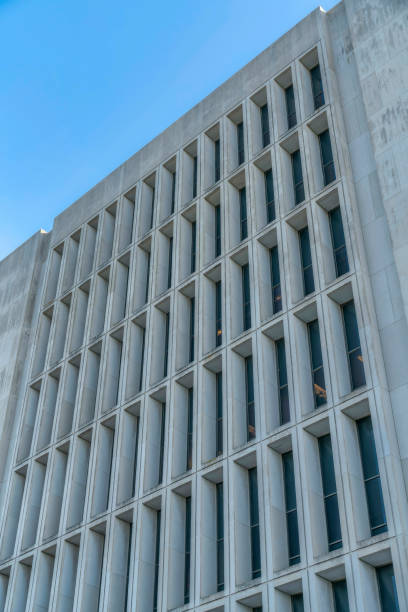 istock Exterior view of concrete modern building with blue sky background 1446641777