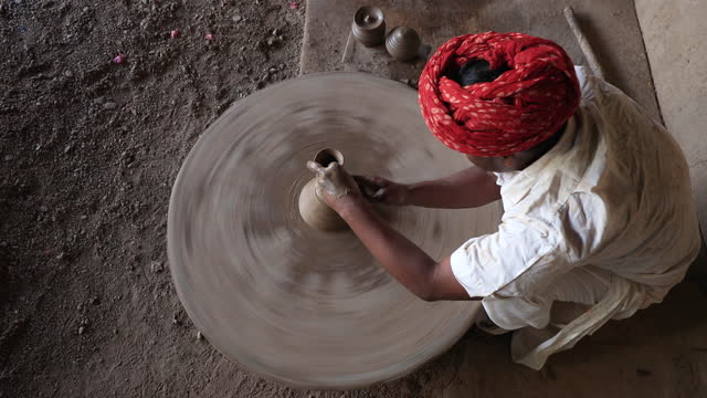 Indian potter working in his workshop, Rajasthan, India
