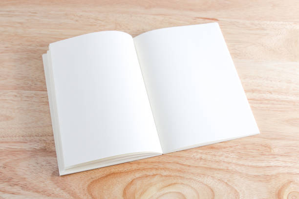 istock Recycled paper book on wooden background 1446646453