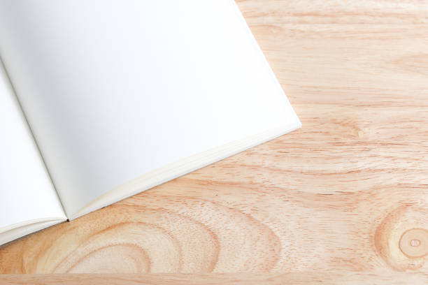 istock Recycled paper book on wooden background 1446646475