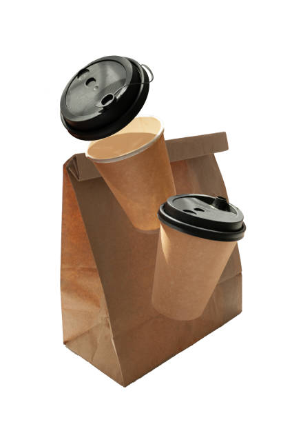 istock coffee in cups and a paper bag fly on a white background 1446648926