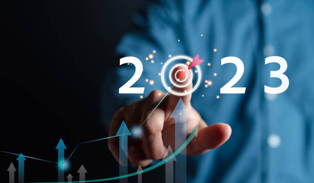 istock Businessman aiming 2023 new year business target planning development leadership and customer target group, investment growth and success development, achievement, goal, strategy, finance concept. 1446651341