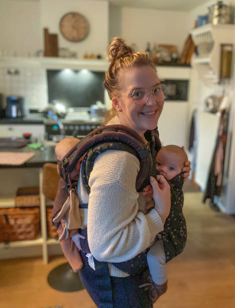 istock Mother carries both her twin 1446653148