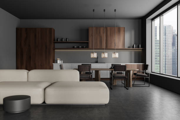 istock Grey studio interior with soft place and cooking area, panoramic window 1446659812