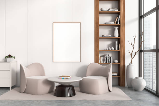 istock Light chill interior with chairs and shelf with books, window and mockup frame 1446660276