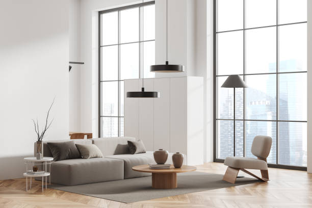 istock Corner view on bright living room interior with sofa, armchair 1446660307