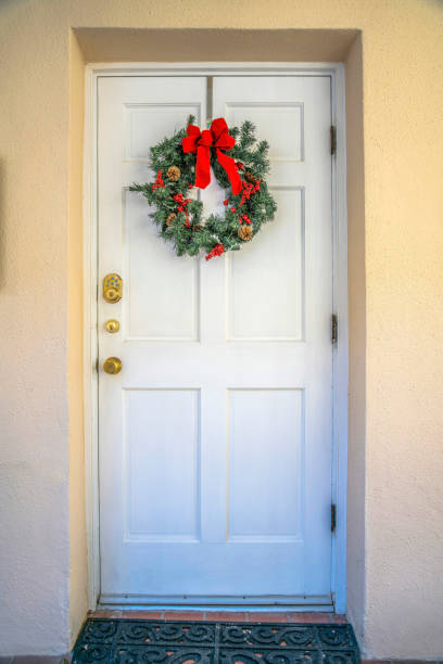 istock Downtown Tucson, Arizona- White front door with decorative wreath 1446660355