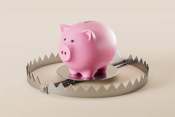 istock Piggy bank on a metallic trap 1446661597