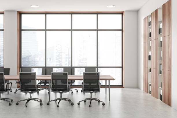istock White conference room interior with board and armchairs near panoramic window 1446661713