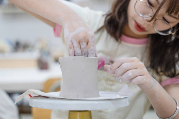 istock A girl who is making clay pots 1446676312
