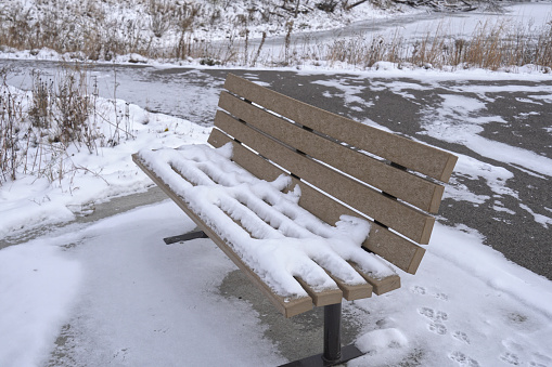 empty bench at a lake