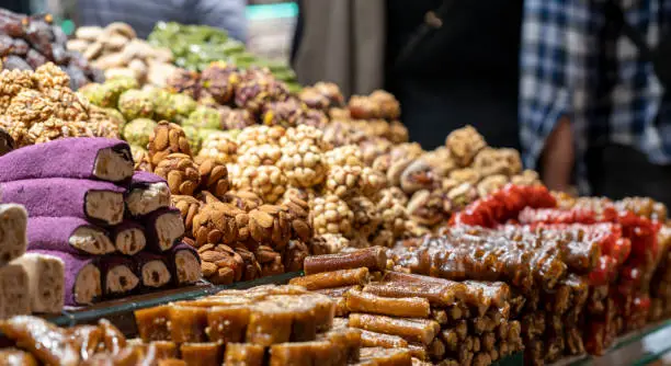 Traditional Turkish dessert baklawa in different flavors and styles in the Egyptian bazaar in Istanbul. Dessert shop at grand bazar baklava ramadan