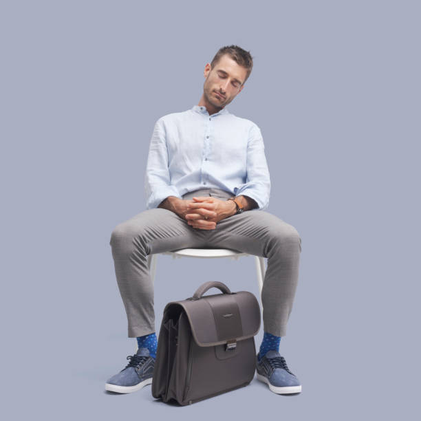 istock Businessman sitting on a chair and sleeping 1446683263