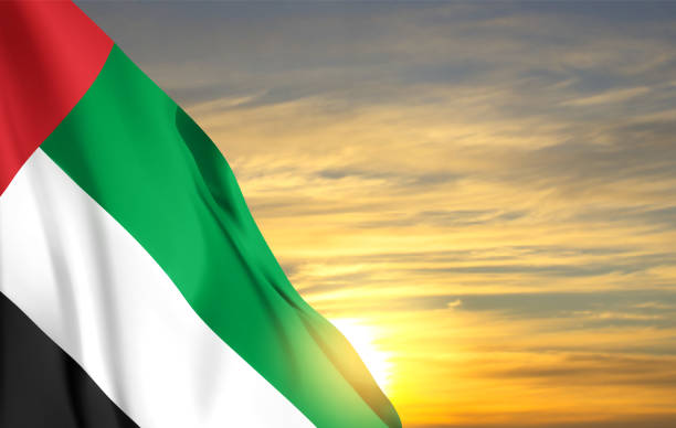 istock UAE flag on background of cloudy sunset or sunrise. Background for National Day 1446685818