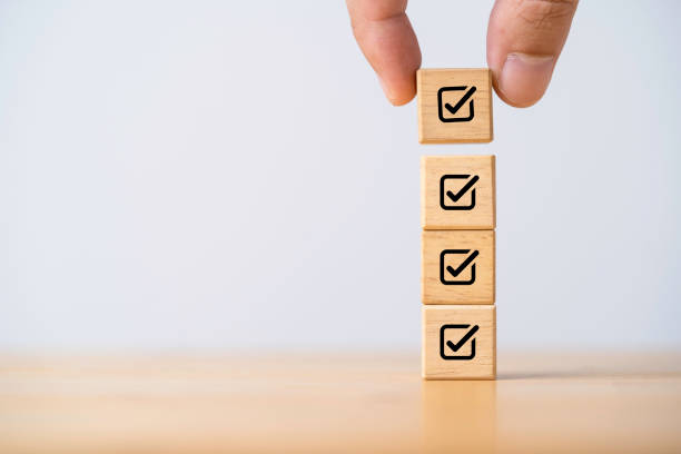 istock Businessman stacking correct sign mark for document approve , project acceptance and quality assurance concept. 1446687879