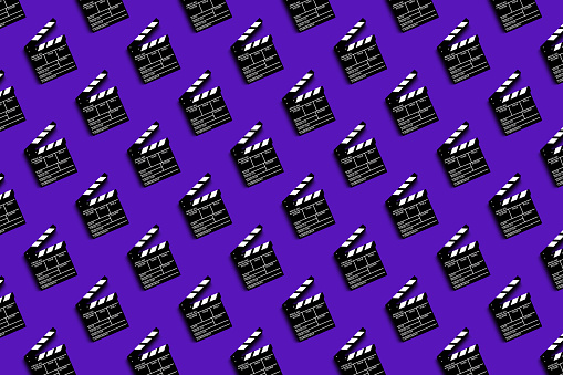 clapper board for shooting video and movies pattern on purple background