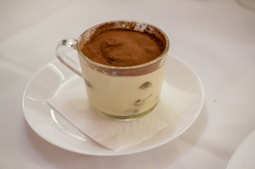Tiramisu in the cup, served on plate