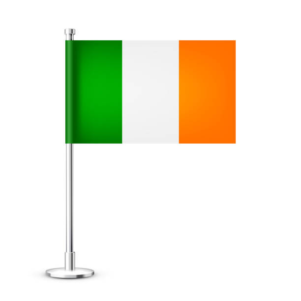 istock Realistic Irish table flag on a chrome steel pole. Souvenir from Ireland. Desk flag made of paper or fabric and shiny metal stand. Mockup for promotion and advertising. Vector illustration 1446691313