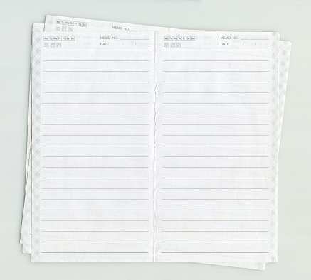 Top view of stack of blank A4 white paper on white board background. Stack of white paper