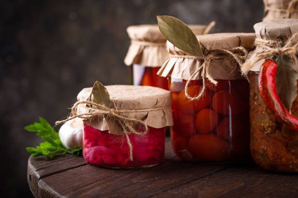 istock Pickled vegetables in glass jars. 1446696867