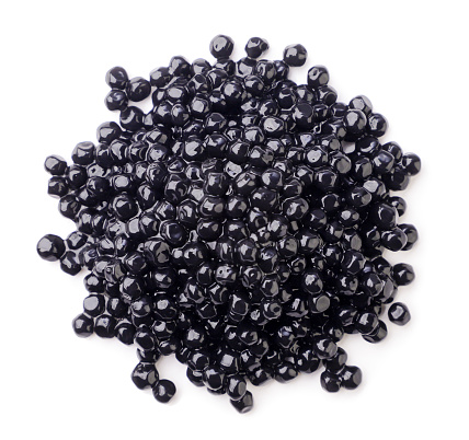 Caviar negro sobre fondo blanco. Vista superior photo