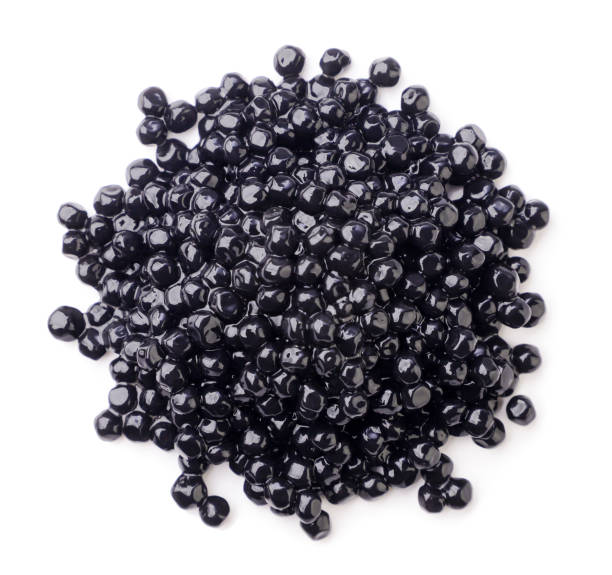 istock Black caviar on a white background. Top view 1446698083