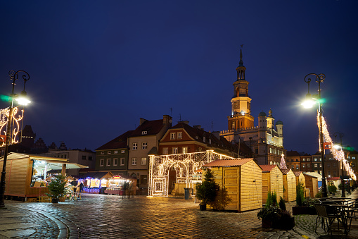 light decorations and wooden stalls at the Christmas market in Poznan