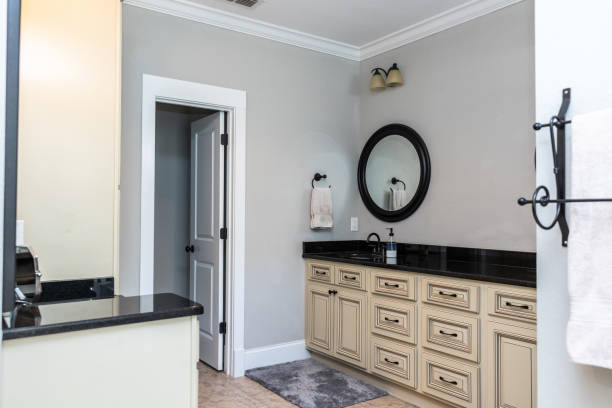 istock A double bathroom vanity with black granite counter tops and cream custom cabinets 1446699177