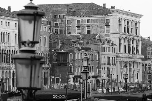 black and white view of buildings in venice with street lamp