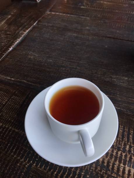 istock Black tea or coffee on the wooden table 1446699847