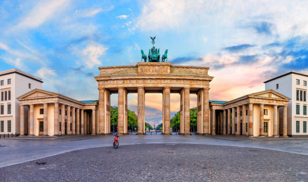 istock Brandenburg Gate or Brandenburger Tor at sunset, panoramic view, Berlin, Germany 1446700454