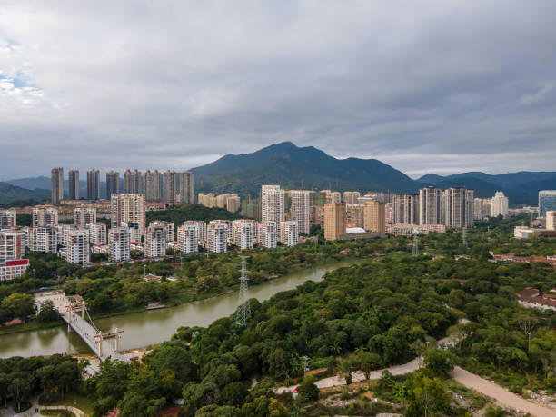 istock Green Space and Urban Buildings by River 1446701139