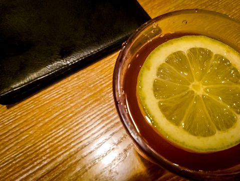 drinking tea mixed with lemon in a restaurant at night is very good for health