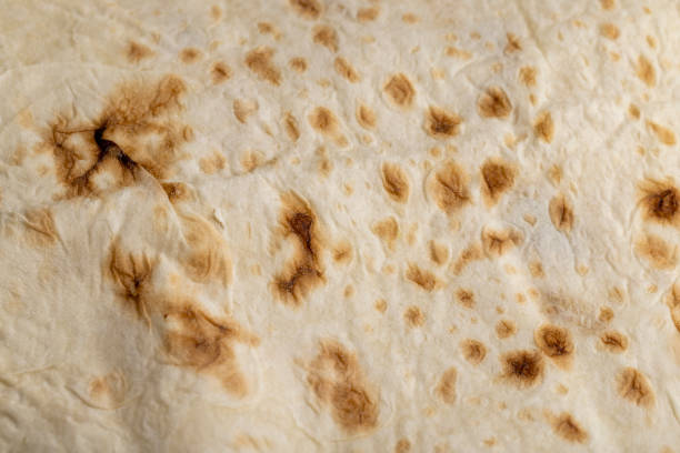 istock Wheat pita bread with dark spots 1446703962