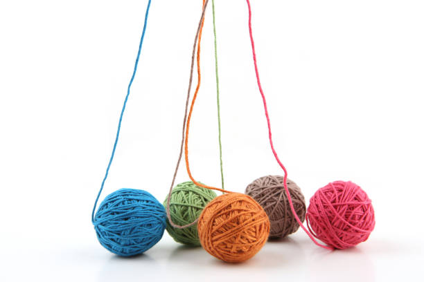 istock Colorful cotton thread balls isolated on white background. 1446706211