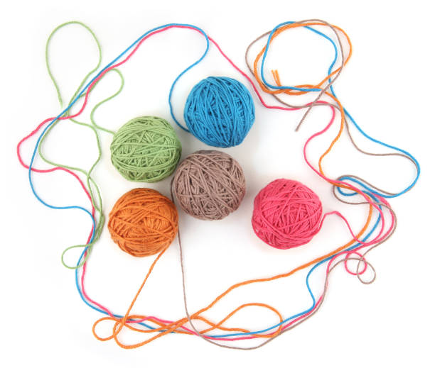 istock Colorful cotton thread balls isolated on white background. 1446706218