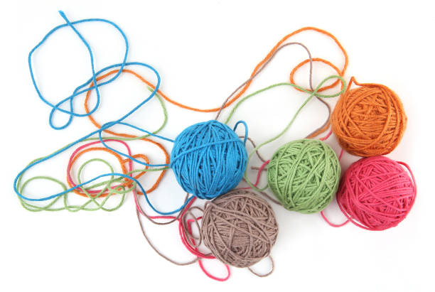 istock Colorful cotton thread balls isolated on white background. 1446706250