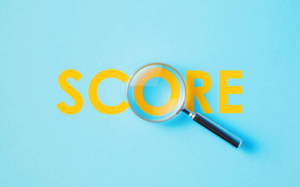 istock Magnifier And Yellow Score Word On Aquamarine Background 1446706876