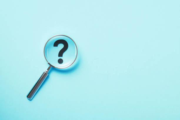 istock Magnifier And Question Mark On Aquamarine Background 1446707452