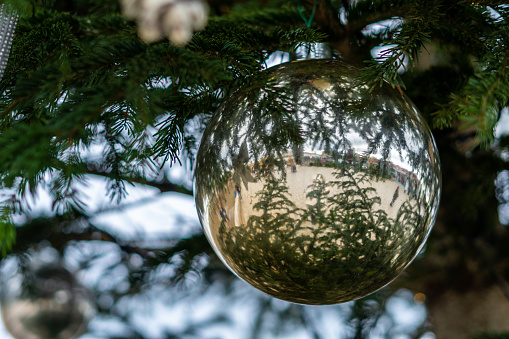 Christmas decorations in the form of a shiny ball hanging on the Christmas tree