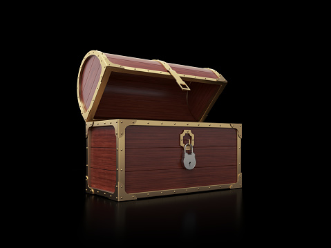 Treasure chest on black background. Horizontal composition with copy space. Side view.