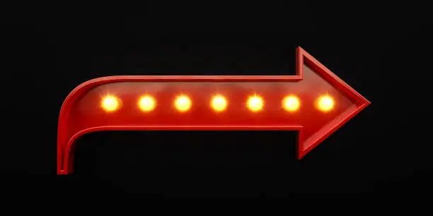 Photo of Light Bulbs Forming A Red Arrow Shape On Black Background