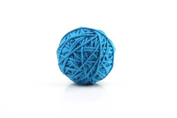 istock Blue cotton thread ball isolated on white background. 1446708187