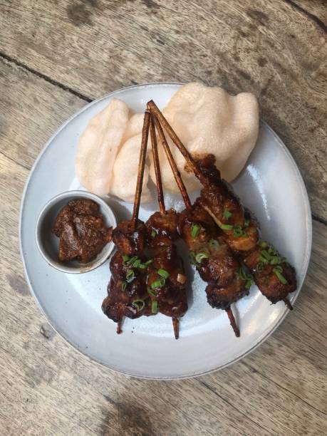 istock Chicken satay on the wooden table 1446708319